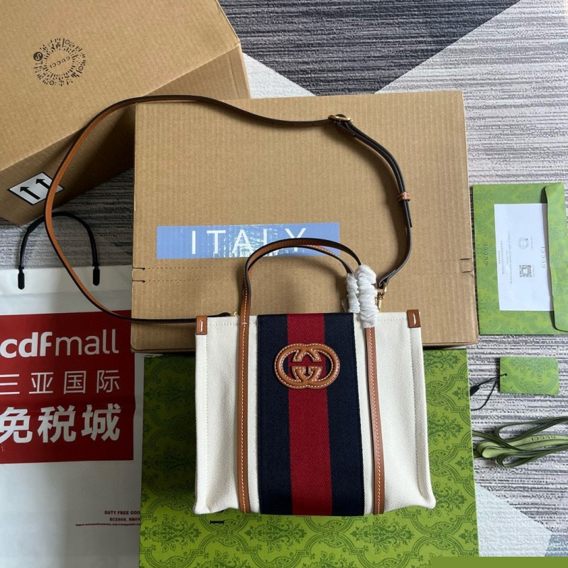 G*u*i shopping bags